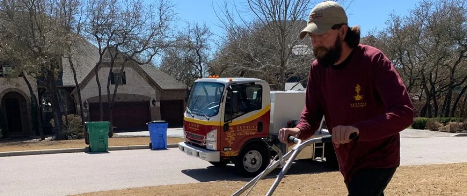 Professional lawn care worker in Austin, TX.